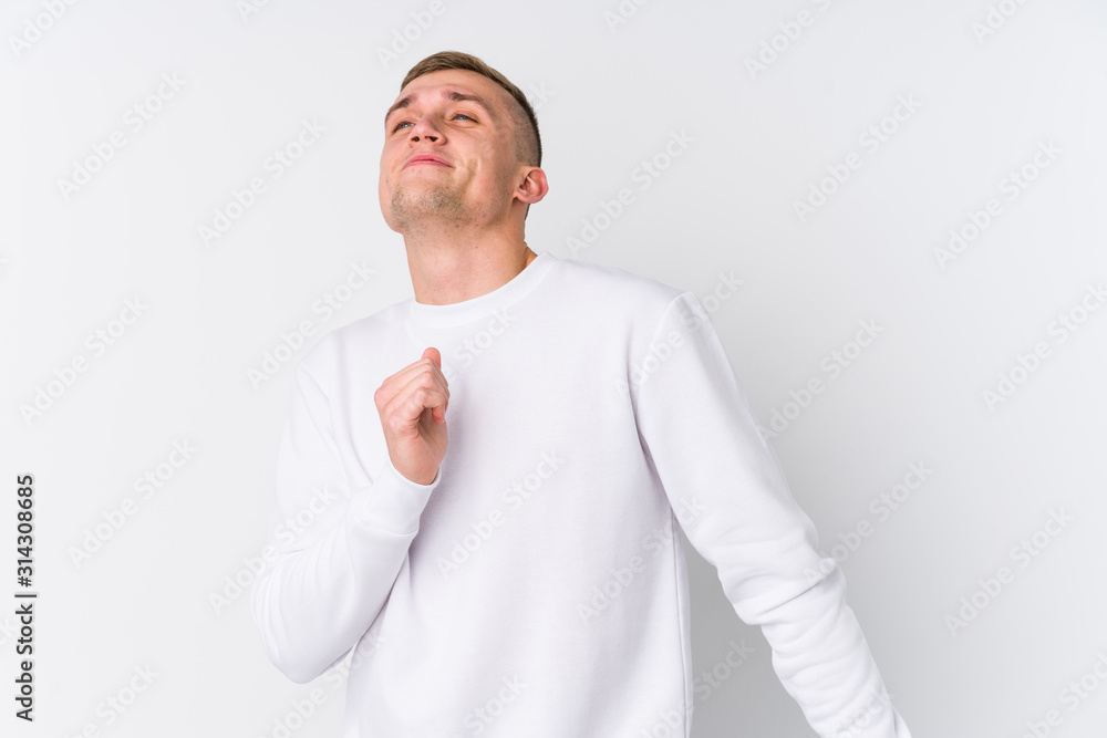 Young caucasian man on white background dancing and having fun. Young caucasian man on white background dancing and having fun.