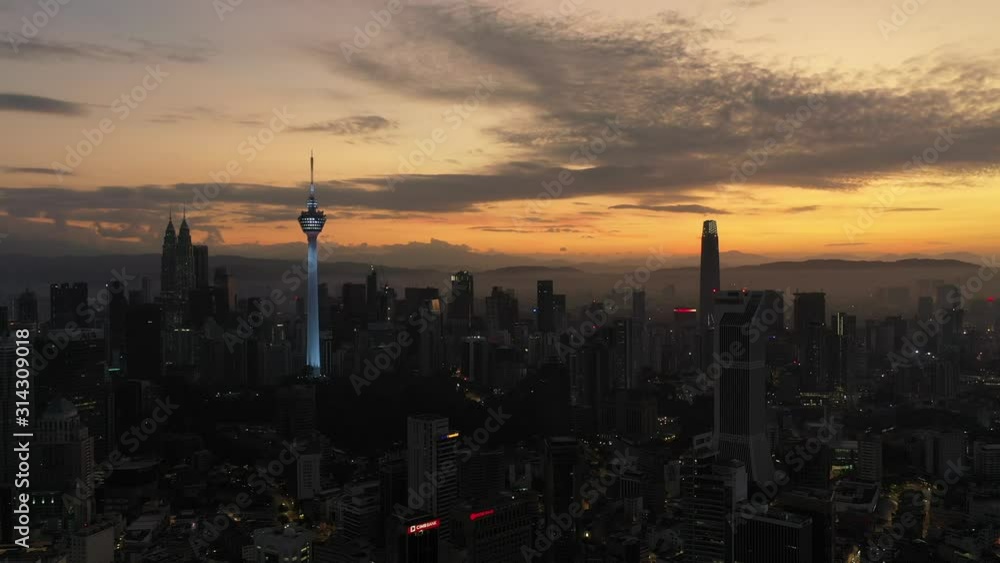 Aerial cinematic drone b-roll shot of sunrise at Kuala Lumpur city skyline. Aerial cinematic drone b-roll shot of sunrise at Kuala Lumpur city skyline.