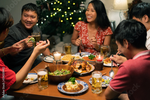 Group of Asian people have a dinner party and beer at home.