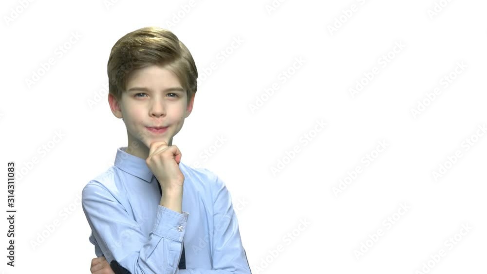 Portrait of thoughtful boy on white background. Pensive caucasian child in baby blue shirt, copy space. Kid has a plan. Portrait of thoughtful boy on white background. Pensive caucasian child in baby blue shirt, copy space. Kid has a plan.