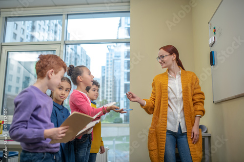Children telling their teacher what to write