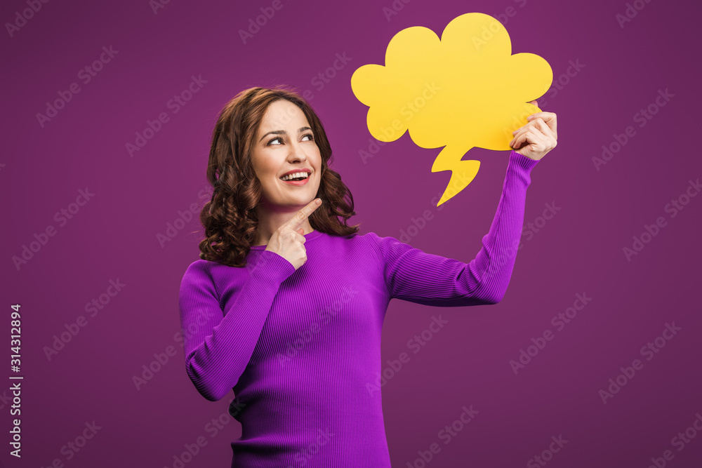 smiling woman pointing with finger at thought bubble on purple background smiling woman pointing with finger at thought bubble on purple background