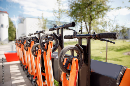 Electric scooters mobile on parking lot. City rental system bike, summer travel trip