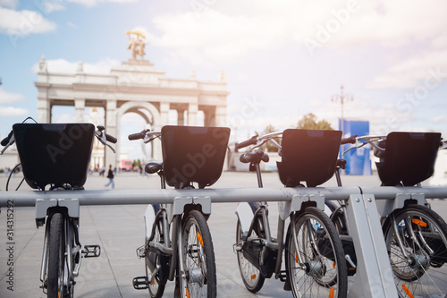 Photography City rental of bicycles from mobile phone, concept tourist transportation in Mos