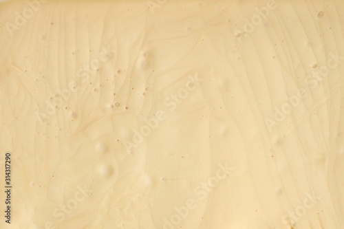 Butter cream white color. Background, texture, close up. Top View