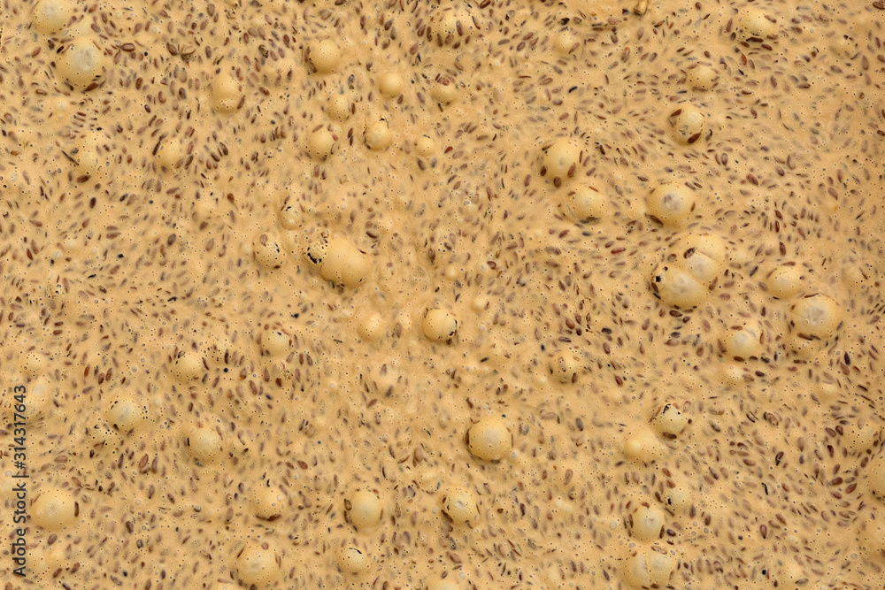 Cream honey, flax seed paste, urbech. Background, texture, close up. Macro