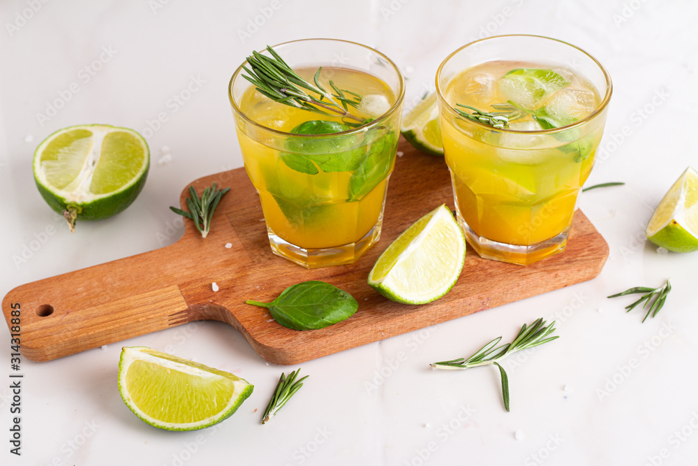 Fototapeta premium drink with lime ice and rosemary in a glass