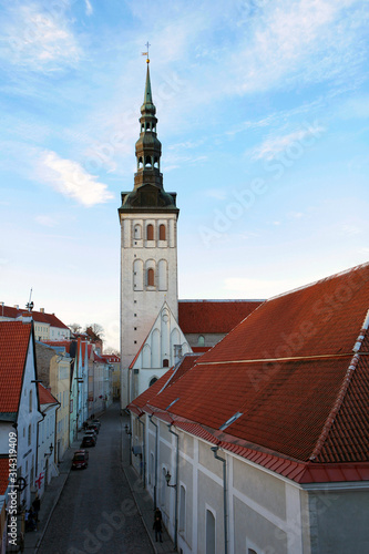 St. Olaf's Cathedral Tower in Tallinn, Estonia. Tallinn old town street View, Estonia. UNESCO heritage in Europe
