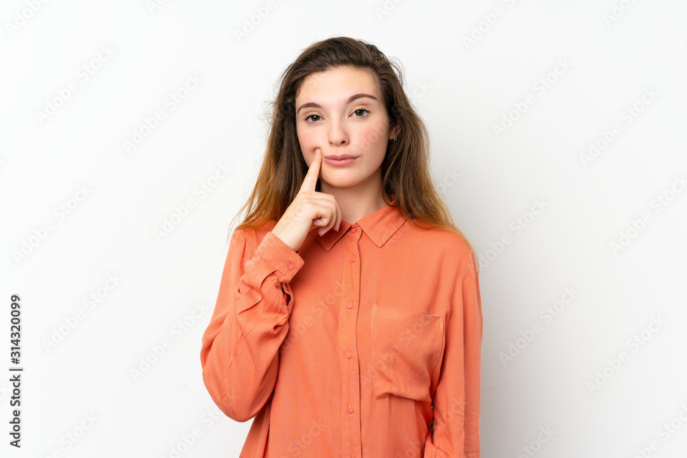 Young brunette girl over isolated white background Looking front Young brunette girl over isolated white background Looking front