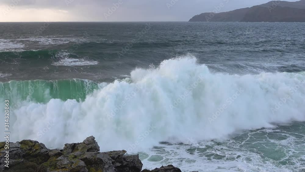 Huge waves breaking at Muckross Head - A small peninsula west of Killybegs, County Donegal, Ireland. The cliff rocks are famous for climbing Huge waves breaking at Muckross Head - A small peninsula west of Killybegs, County Donegal, Ireland. The cliff rocks are famous for climbing