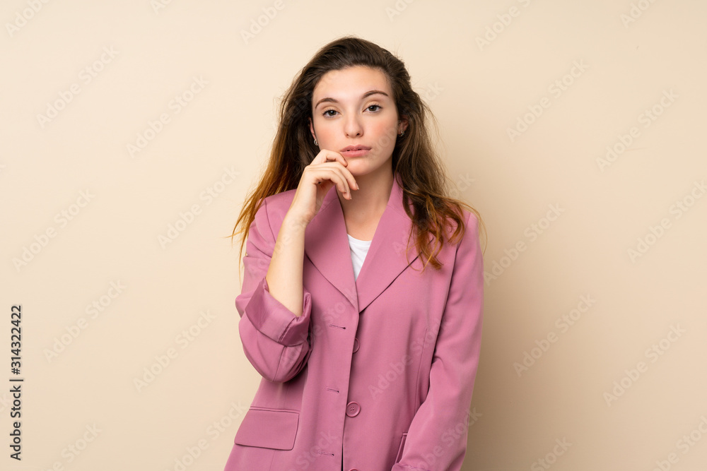 Young brunette girl with blazer over isolated background thinking Young brunette girl with blazer over isolated background thinking