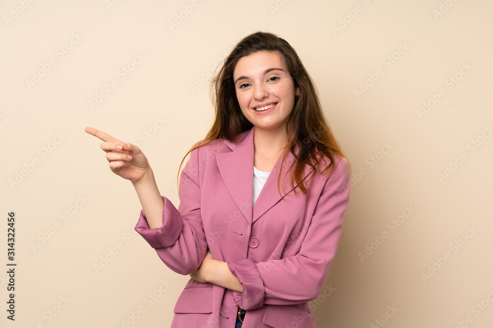 Young brunette girl with blazer over isolated background pointing finger to the side Young brunette girl with blazer over isolated background pointing finger to the side