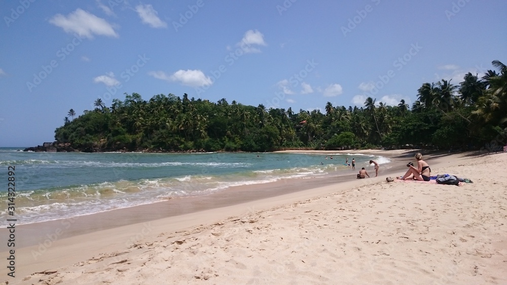 Tropical beach, blue water, holidays in Sri Lanka