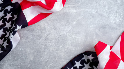 Frame of US American flags on concrete stone background. Banner template for Presidents day, USA Memorial day, Veterans day, Labor day, or 4th of July celebration. With blank space for text