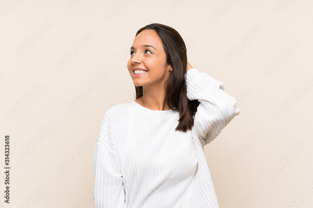Young brunette woman with white sweater over isolated background laughing Young brunette woman with white sweater over isolated background laughing