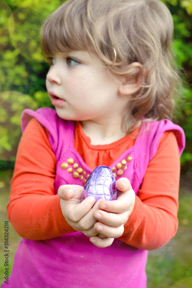 cute little girl looking for easter eggs cute little girl looking for easter eggs