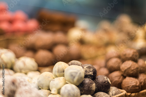 Piles of chocolate bonbons in a shop window