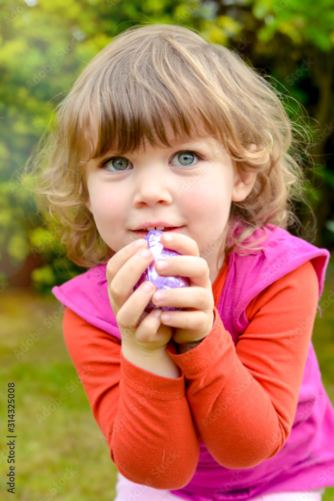 cute little girl looking for easter eggs cute little girl looking for easter eggs