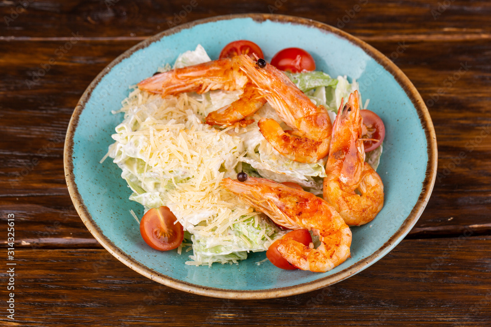 Salad with shrimp, grated parmesan cheese and salad leaves Salad with shrimp, grated parmesan cheese and salad leaves