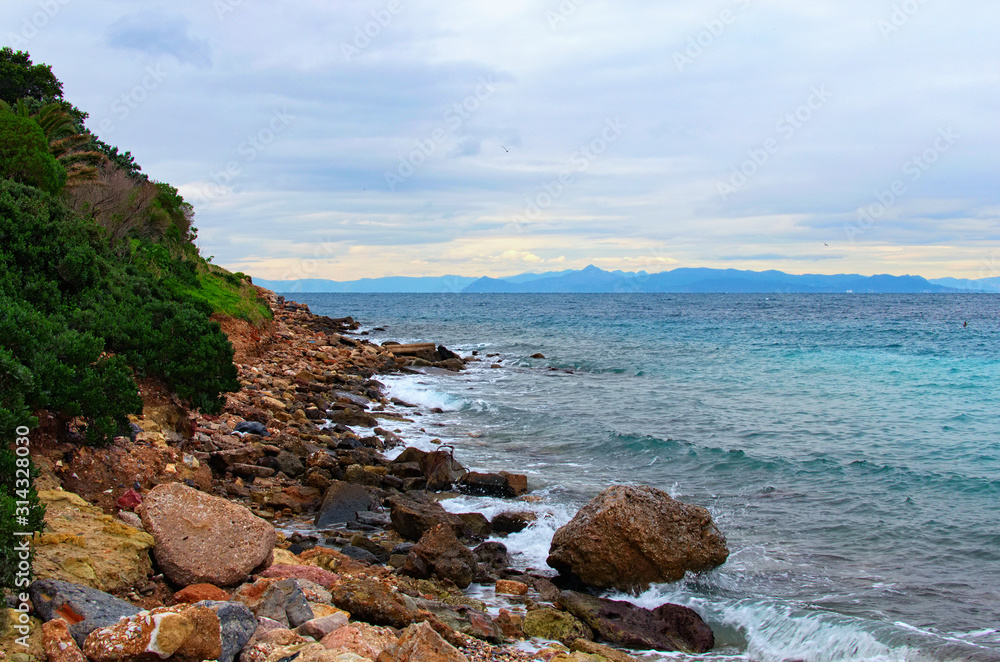 Scenic winter landscape of Glyfada Beach in Athens. Saronic Gulf. Famous public beach. Natural composition. Romantic and peaceful scene. Athens, Greece Scenic winter landscape of Glyfada Beach in Athens. Saronic Gulf. Famous public beach. Natural composition. Romantic and peaceful scene. Athens, Greece