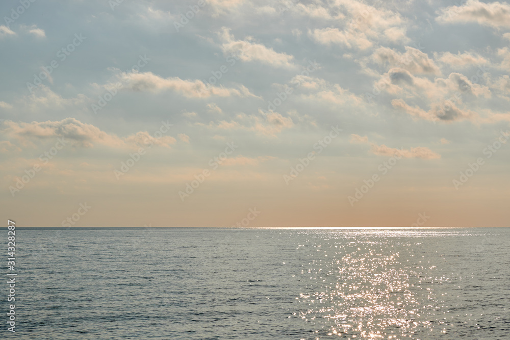 Fototapeta premium Seascape with calm water and warm light