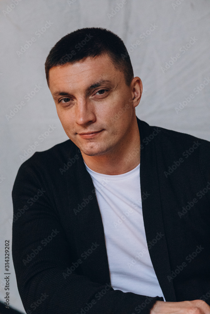 Obraz premium Photo session of a young guy. Classic portrait of a confident man.