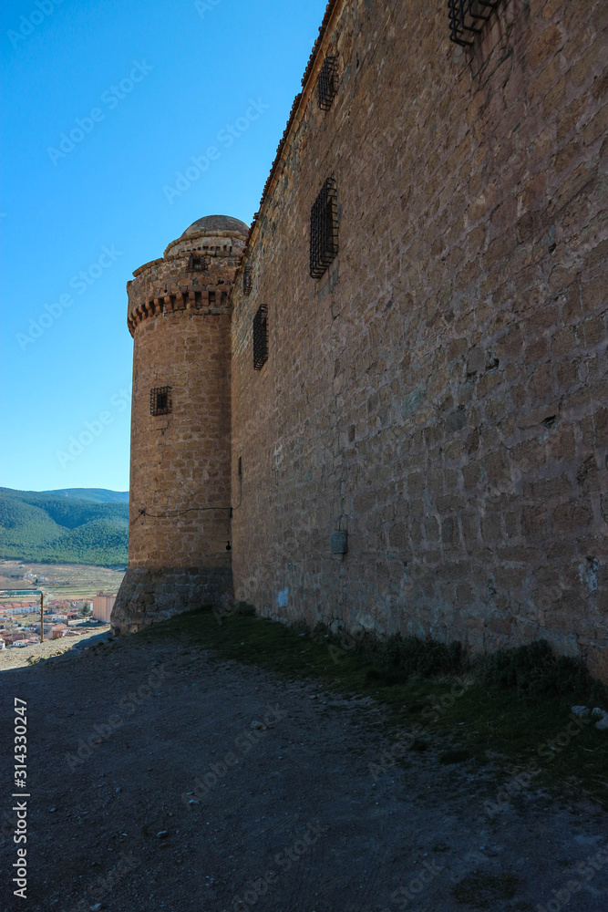 Tower and wall of medieval castle La Calahorra, Granada, Andalucia, Spain Tower and wall of medieval castle La Calahorra, Granada, Andalucia, Spain