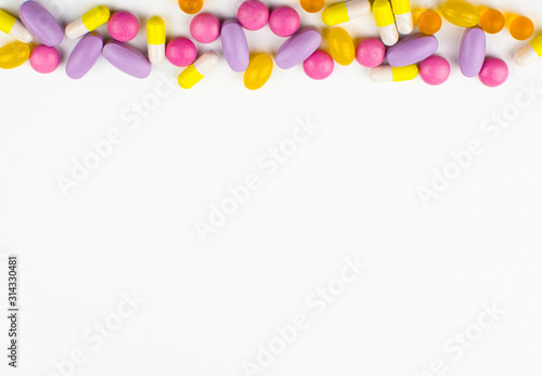 various medicines, colored capsules, pills, pharmacy drugs on a white background, the concept of medicines, pharmacy business