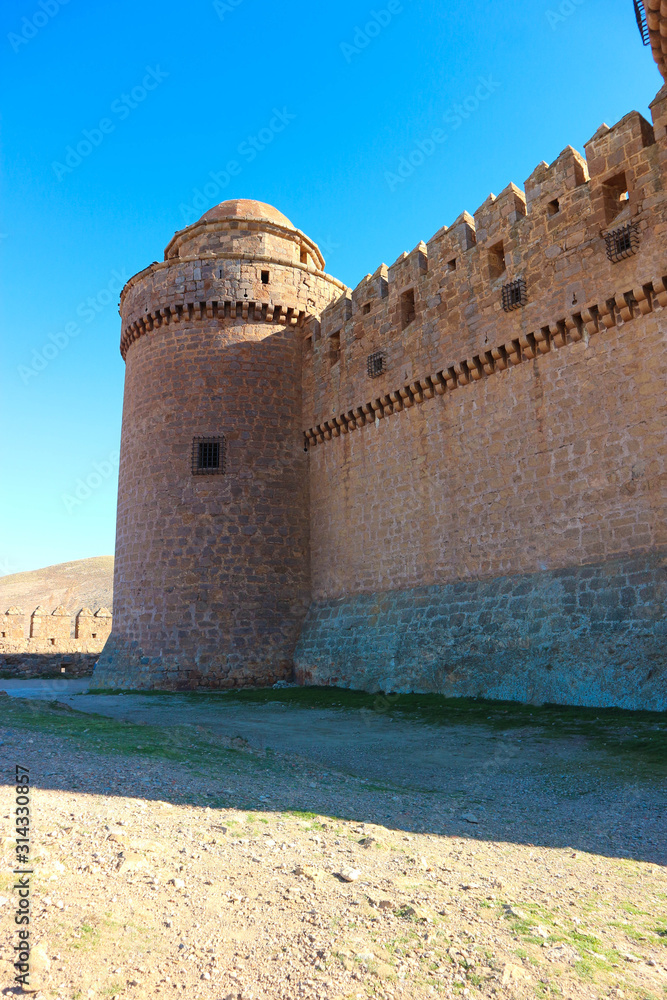 Tower and wall of medieval castle La Calahorra, Granada, Andalucia, Spain