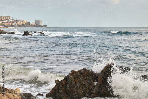 Strong waves in the sea hitting the rocks of the coast