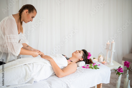 Young girl in spa massage on holiday 