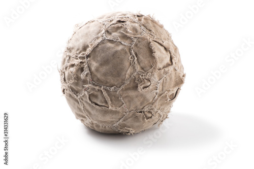 Old, shabby leather soccer ball on white background. © Andris Tkachenko