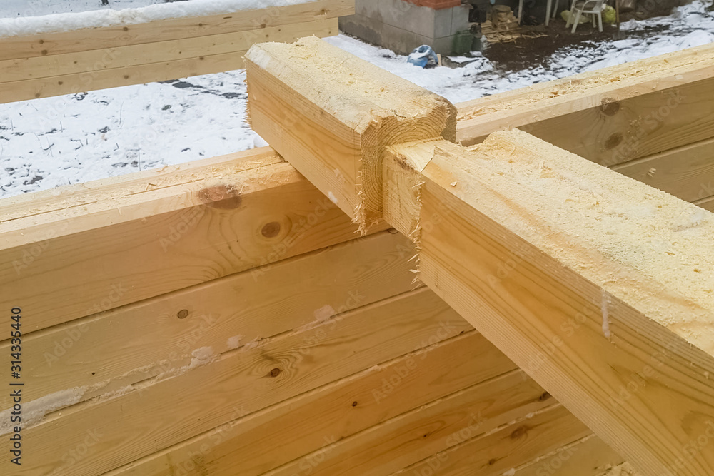 Details and elements of wooden house made of timber. The constru