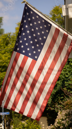 American flag hanging outside of a hose