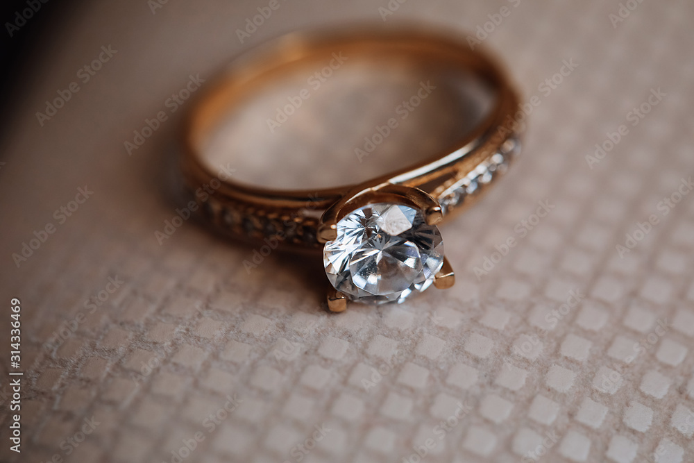 Precious golden engagement ring with big diamond Precious golden engagement ring with big diamond