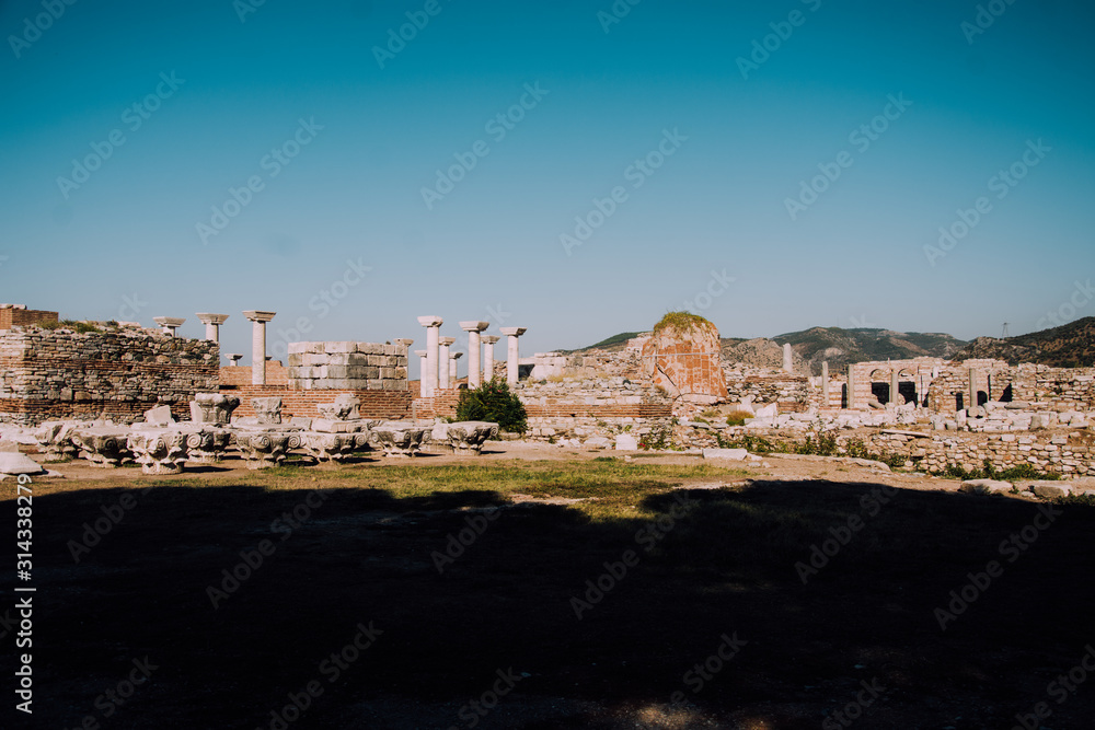 Antique city of Selcuk.Ruins of ancient city in Turkey.i.Archaeological site,expedition.Remains of an ancient Greek city in mountains.Stone old column.Place for text.Old architecture