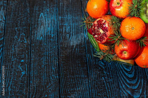 New Year fruits on a blue siol. photo