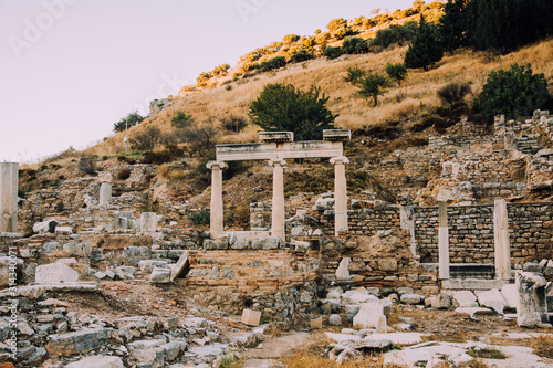 Antique city of Ephesus.Ruins of an ancient city in Turkey.Selcuk, Kusadasi,Turkey.Archaeological site,expedition.Remains of an abandoned ancient Greek city.Antique statues and columns.Place for text. photo