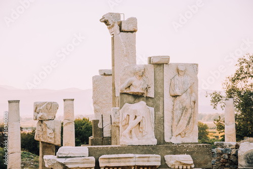 Antique city of Ephesus.Ruins of an ancient city in Turkey.Selcuk, Kusadasi,Turkey.Archaeological site,expedition.Remains of an abandoned ancient Greek city.Antique statues and columns.Place for text. photo