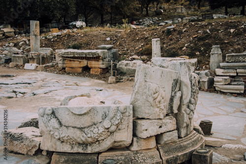 Antique city of Ephesus.The ruins of an ancient city in Turkey.Selcuk, Kusadasi, Turkey.Archaeological site, expedition.Remains of an abandoned ancient Greek city.Pattern on the stone.Stone carving. photo