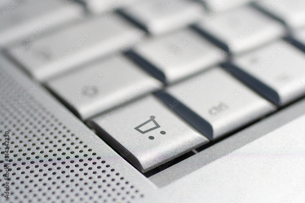 Close up shot of a laptop keyboard with a cart key in focus. Close up shot of a laptop keyboard with a cart key in focus.