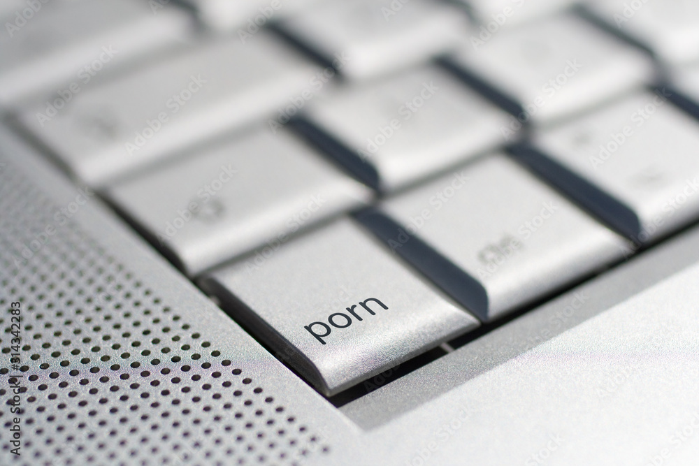 Close up shot of a laptop keyboard with a porn key in focus. Stock Photo |  Adobe Stock