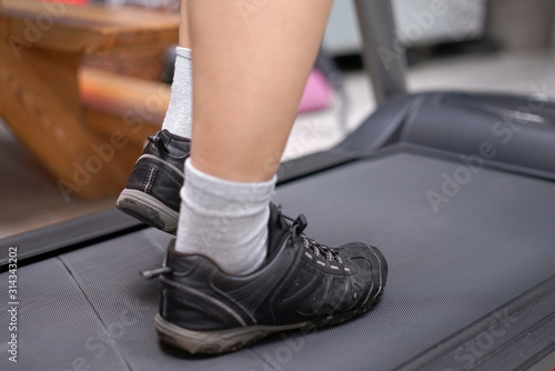 woman's feet during treadmill training