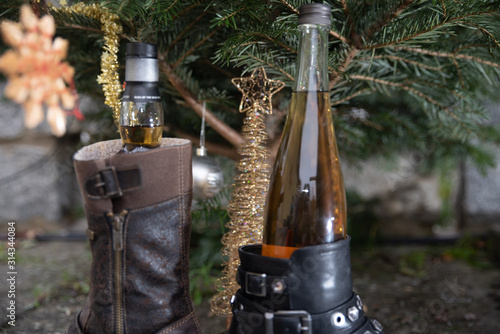 Christmas tree with a bottle of whisky in a shoe photo