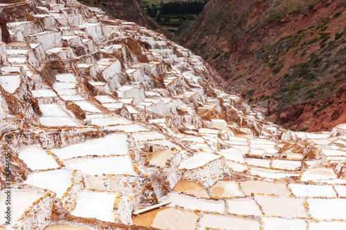 Salt evaporation ponds Salineras in Maras, Peru, Latin America. Salt mining since the Inca Empire.