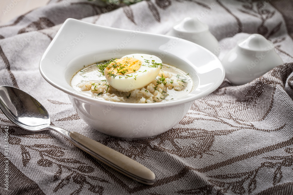 Sorrel soup with egg in white bowl. Sorrel soup with egg in white bowl.