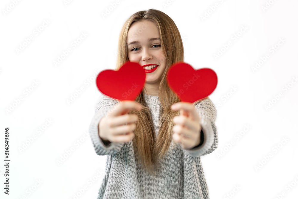 Close-up portrait of nice attractive lovely girlish cheerful girl holding in hands two heart symbol cards closing eyes isolated on white background Close-up portrait of nice attractive lovely girlish cheerful girl holding in hands two heart symbol cards closing eyes isolated on white background