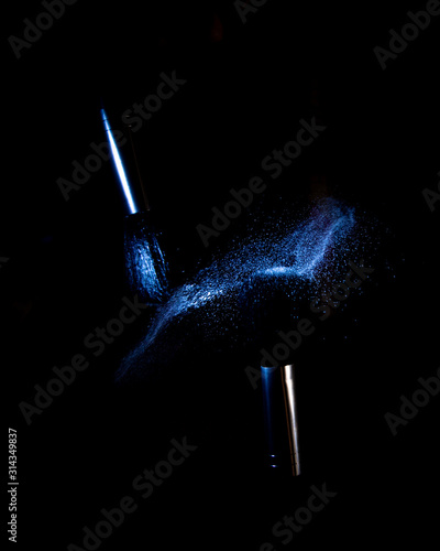 flying shadows from colliding makeup brushes