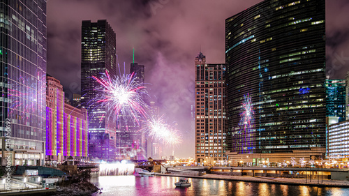 A beautiful fireworks display to celebrate the New Year in Chicago along the Chicago River.