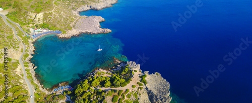 Aerial drone ultra wide photo of famous paradise rocky bay and beach of Anthony Quinn in Rodos island, Dodecanese, Greece © aerial-drone
